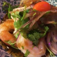 Shabu-Shabu Shrimp · Poached shrimp served with red onion, cilantro and onion ponzu sauce.