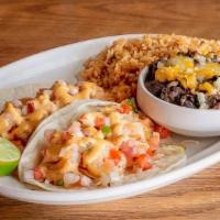 Baja Shrimp Tacos · 2 flour tortillas | baja style shrimp | pico de gallo | shredded cabbage | chile lime mayo