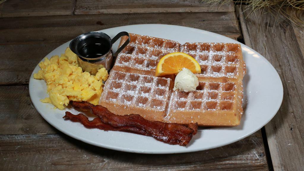 Waffle Tractor Driver Combo · Choice of Waffle served with two eggs with choice of bacon, sausage links, turkey sausage patties or potatoes. Served with butter and syrup.