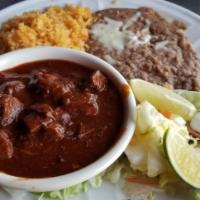 Chile Colorado · Chunks of beef cooked in a chef's special red chile pasilla sauce.