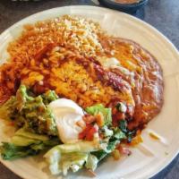 Classic Chimichanga · Fried burrito filled with beans, shredded beef, shredded chicken, or chorizo. topped with gu...