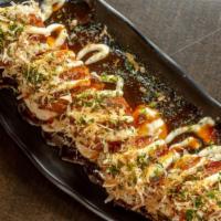 Takoyaki · Crispy octopus balls served with tartar mayo and okonomi sauce and garnished with bonito fla...