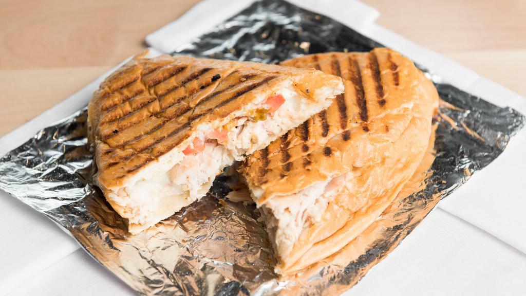 Chicken Panini Sandwich · Bok bok rotisserie chicken, tomato and traditional garlic spread in a pressed French roll.