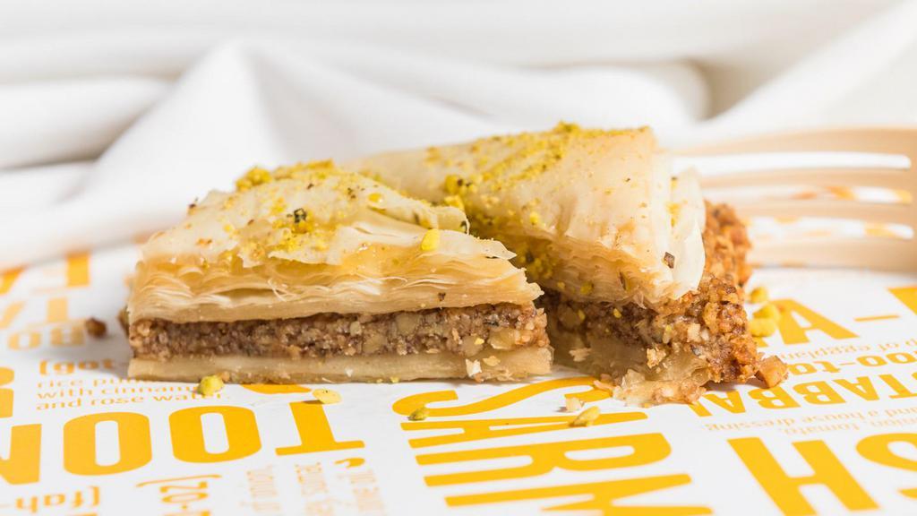 Baklava · Layers of filo pastry and nuts soaked in rosewater syrup.