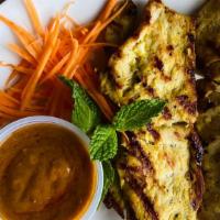 Chicken  Satays · Grilled chicken satays on 4 skewers with a side of spicy coconut peanut sauce.