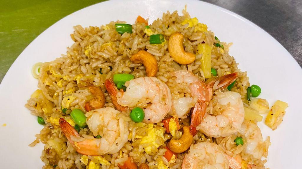 Pineapple Paradise · Fried rice with pineapple chunks, egg, onions, peas, carrots and cashews.