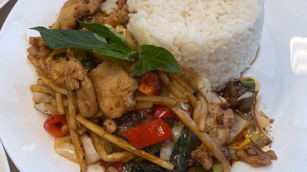 Phad Phet · Medium spicy. Stir fried bamboo shoots, cabbage,onions, bell peppers, basil and kaffir leaves in thai curry sauce .