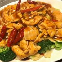 Mongolian Chicken · Tender sliced chicken wok tossed in our special hot sauce placed on a bed of sautéed fresh m...