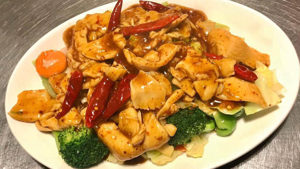 Mongolian Chicken · Tender sliced chicken wok tossed in our special hot sauce placed on a bed of sautéed fresh mixed vegetables.