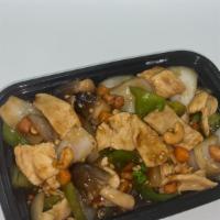 Cashew Chicken · Tender sliced chicken sautéed with green peas, diced carrots, mushrooms, bell peppers, and o...