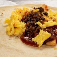 #09 Santa Fe · Ground beef, egg, potatoes, onion, red chile, and cheese. 780 calories.