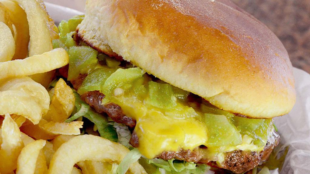 Green Chile Cheeseburger · Grilled bun, chopped green chile, cheese, lettuce, tomato, mustard and ketchup. Made with 100% all Angus beef patties. 910 calories.