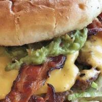 Cali Cheeseburger · Grilled bun, bacon, guacamole, and cheese, lettuce, tomato, onion, mustard and ketchup. Made...