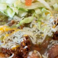 Indian Taco · Indian Fry bread with choice of meat and chili, beans, cheese, lettuce, and tomato.