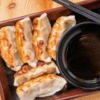 Gyoza (6) · Pan-fried pork with veggie stuffing with house special sauce.