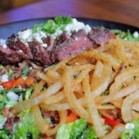 Steak Salad (D) · Sliced char-broiled flank steak, crisp romaine, red onion, diced tomato, tossed in creamy, h...
