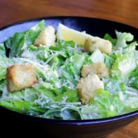 Caesar Salad (D) · Romaine, parmesan, tossed in house-made Caesar dressing, topped with parmesan croutons.