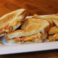 Ultimate Grilled Cheese (D) · Tillamook cheddar/Monterey jack/thick peppered bacon/tomato/grilled French bread.