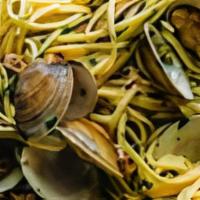 Linguini Alle Vongole · Clams sauteed in a white wine sauce with garlic.