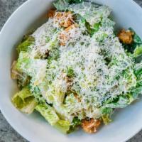 Caesar Salad  - · Romaine lettuce, roasted garlic Caesar dressing, house made rosemary croutons, grated Parm -...