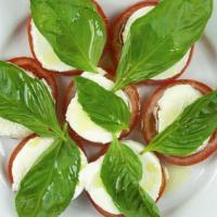 Caprese · Mozzarella in water organic: tomato slices basil leafes italian olive oil