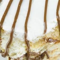 Milhojas · Four layers of puff pastry layered with sweet caramel cream and finished with whipping cream...