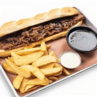 Brisket French Dip · Texas Beef Brisket, Caramelized Onions and Provolone Cheese on a toasted Hoagie, served with...
