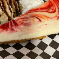 Strawberry Cheesecake · Slice of strawberry cheesecake with scoop of ice cream, whipped cream, chocolate and caramel...