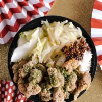 Popcorn Chicken Rice Bowl · A rice bowl with our popcorn chicken on top and pickled veggies on the side. Add furikake an...
