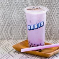 Taro Milk Tea · Our house milk tea one of our most popular drinks. made with a golden black tea non dairy cr...