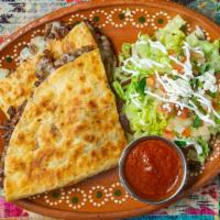 Quesadillas · Flour tortilla, loaded with our blend of cheeses and your choice of meat.