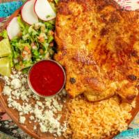 Milanesa De Pollo · Breaded chicken breast, served with refried beans, rice, fresh salad and lime wedges. Accomp...