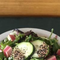Seared Ahi Tuna Salad · Mixed greens, wasabi, peas, edamame, cucumber, cherry tomatoes, and ginger vinaigrette.