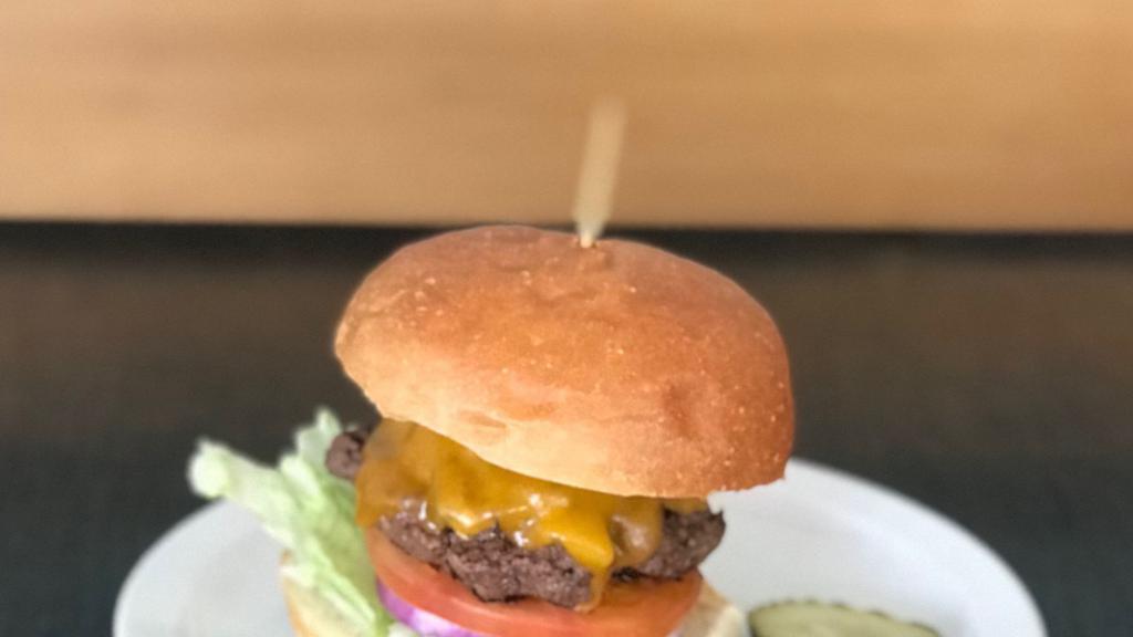 Green Chile Cheeseburger · Cheddar cheese and roasted green chile.