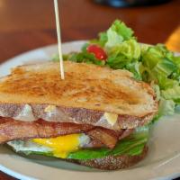 Fried Egg Blt Sandwich · Pecanwood smoked bacon, Mozzarella Jack cheese, lettuce, tomato, and mayo.