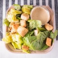 Caesar Salad (Side) · Fresh cut Romaine lettuce tossed with a tangy house made Caesar dressing and topped with cro...