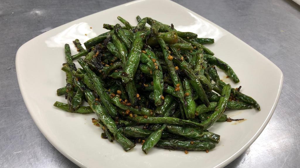 Dried Sauteed String Bean With Minced Pork     干煸四季豆 · Hot & spicy.