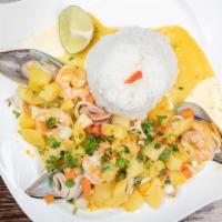 Cau Cau De Mariscos · Fresh seafood stew made of scallops, squid, mussels, and shrimp with chunk potatoes. Seasone...