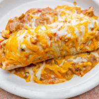 Breakfast Burrito · 2 eggs, potatoes and bacon, smothered with green chile and cheddar cheese. (No side.)