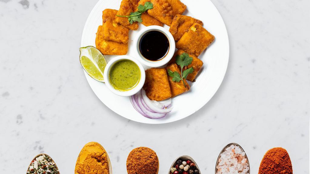 Paneer Pakoras · Fresh cottage cheese dipped in a spicy batter and fried until golden crisp.