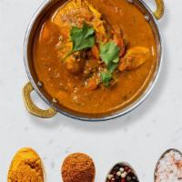 Free-Love Chicken Curry · Peace out with free-range chicken breast in a tomato based onion gravy with freshly ground s...