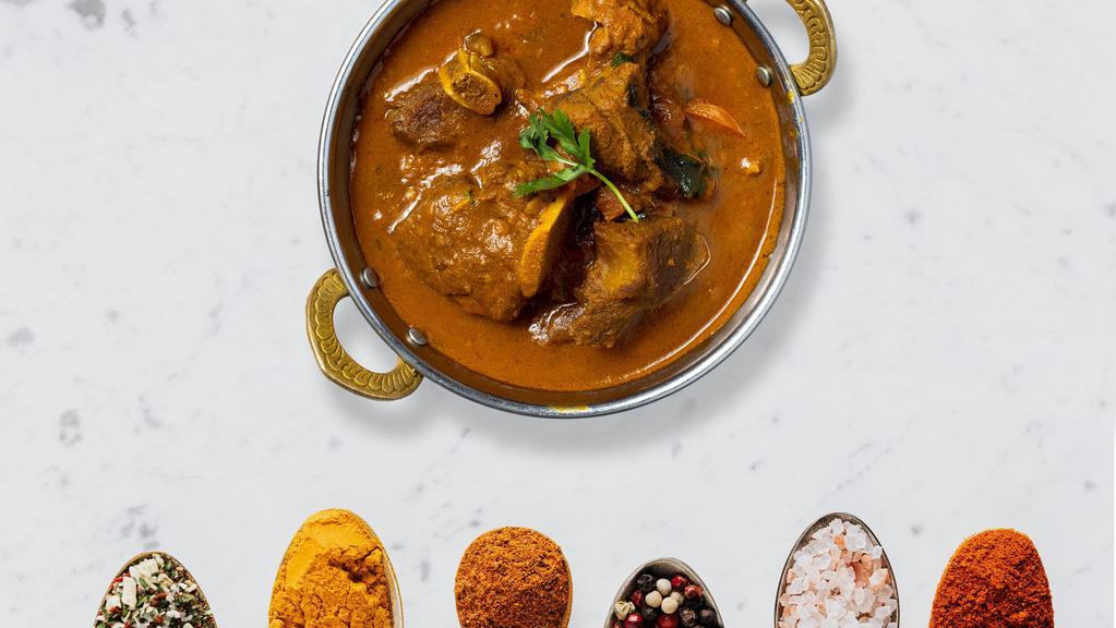 Lovin' Goat Curry · Pieces of goat on the bone cooked in delicately spiced onion based sauce.