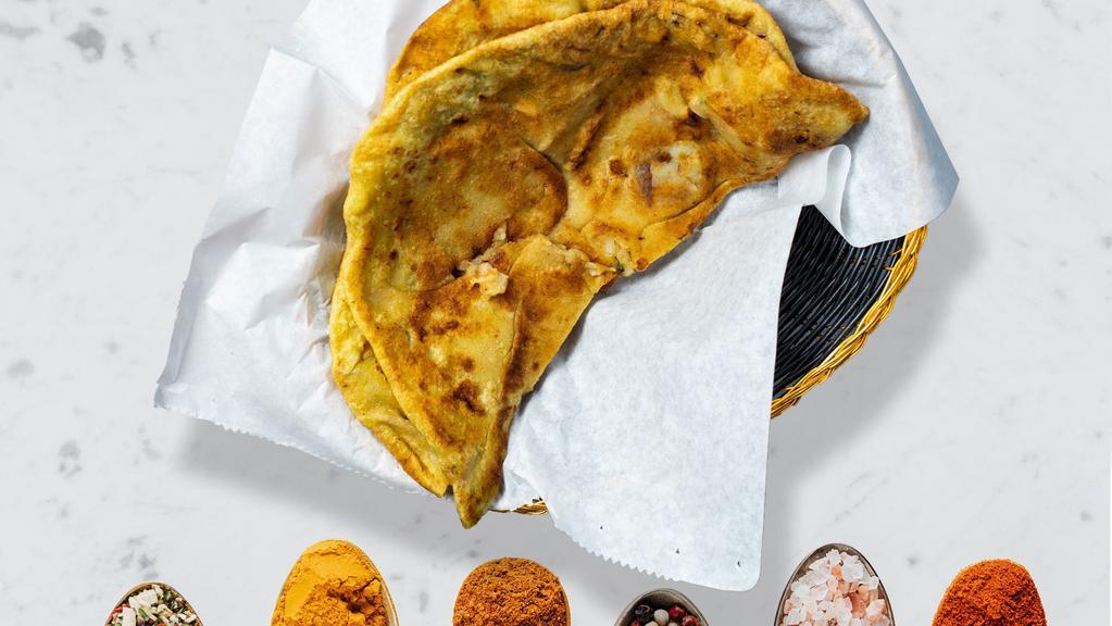 Aloo Paratha · Indian bread stuffed with spiced potatoes and cooked on a tawa pan.