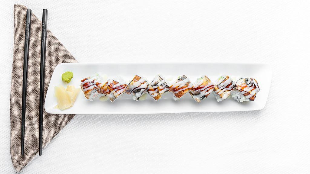 Dragon Roll · Crab, avocado, and cucumber roll. Topped with unagi eel.