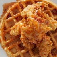 Chicken & Waffles · Crispy fried chicken tenders on a Belgian waffle, drizzled with house-made chipotle honey.
