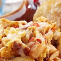 Big Easy Scrambler · Scrambled eggs, Louisiana crawfish tails, andouille, onions, red peppers and fresh country p...