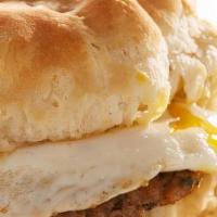 Broken Egg® Biscuit Sandwich · Fried chicken tender and a BROKEN EGG® topped with country sausage gravy on an over-sized bi...