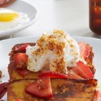 Strawberry Pound Cake French Toast · French toast-style pound cake topped with fresh strawberries, fresh whipped cream and crème ...
