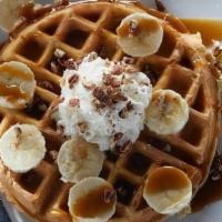 Bourbon Street Waffle · Belgian waffle topped with bananas, pecans, rum butter sauce drizzle and fresh whipped cream.