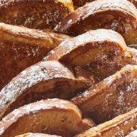 Classic French Toast Platter · 20 pieces of thick-sliced bread battered and grilled, topped with powdered sugar. Served wit...